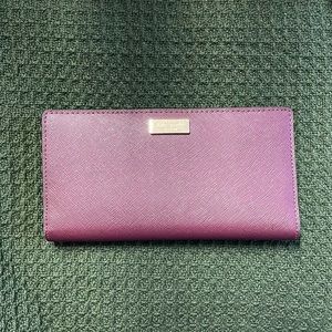 Comparable to the spencer slim bi-fold wallet. Very very lightly used.🥺